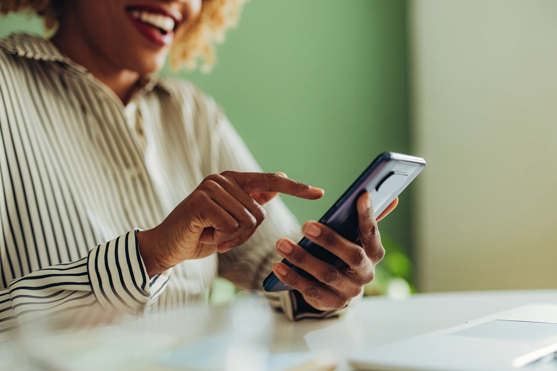 Woman using phone for instant payment