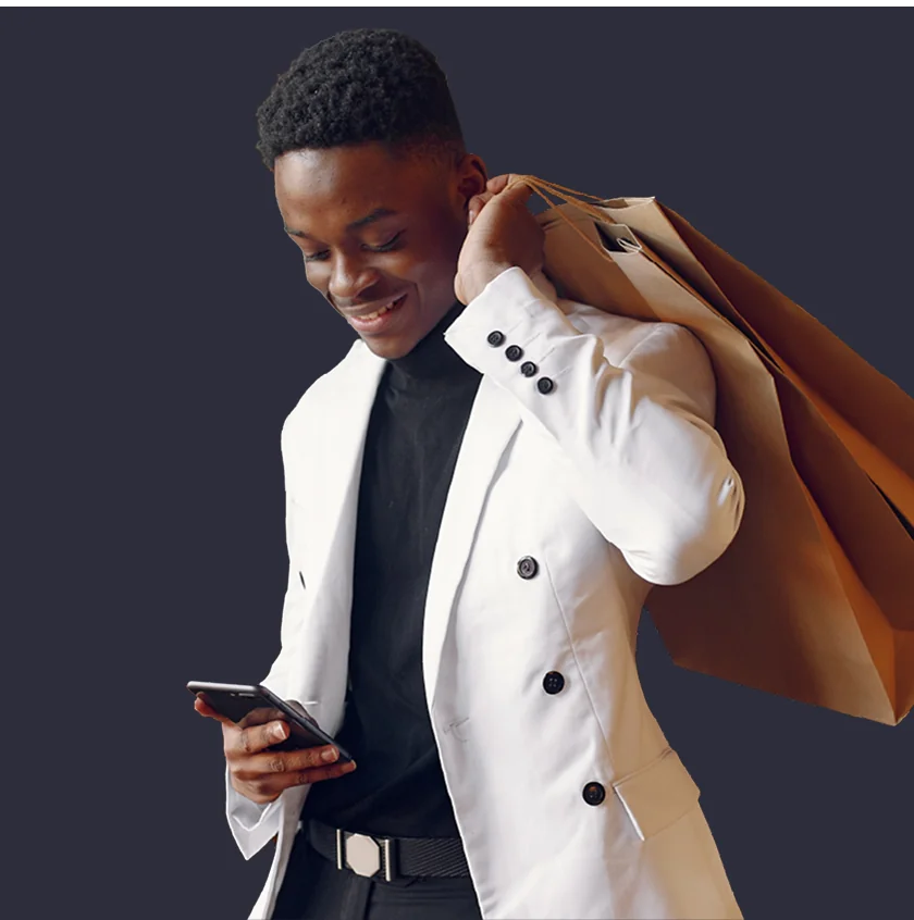 Man with shopping bags checking phone