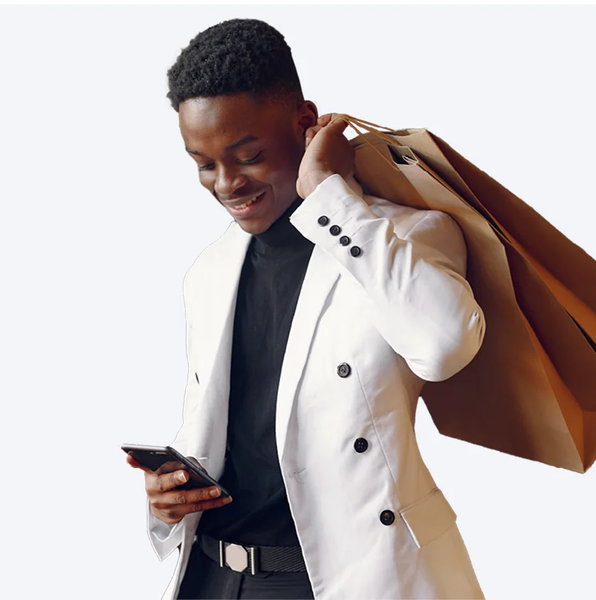 Man with shopping bags checking phone