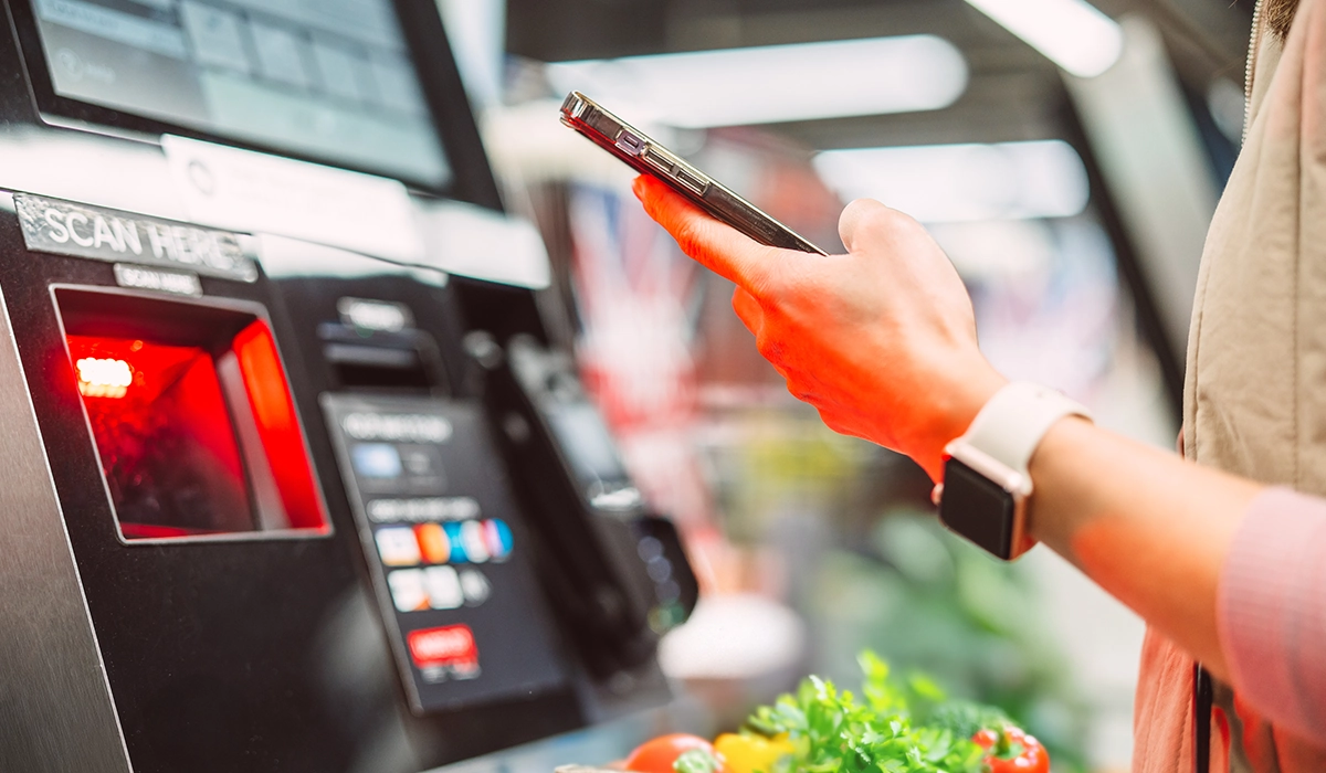 Person using SendMoney Voucher at store