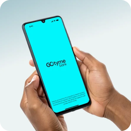 Hand holding phone with GoTyme Bank app