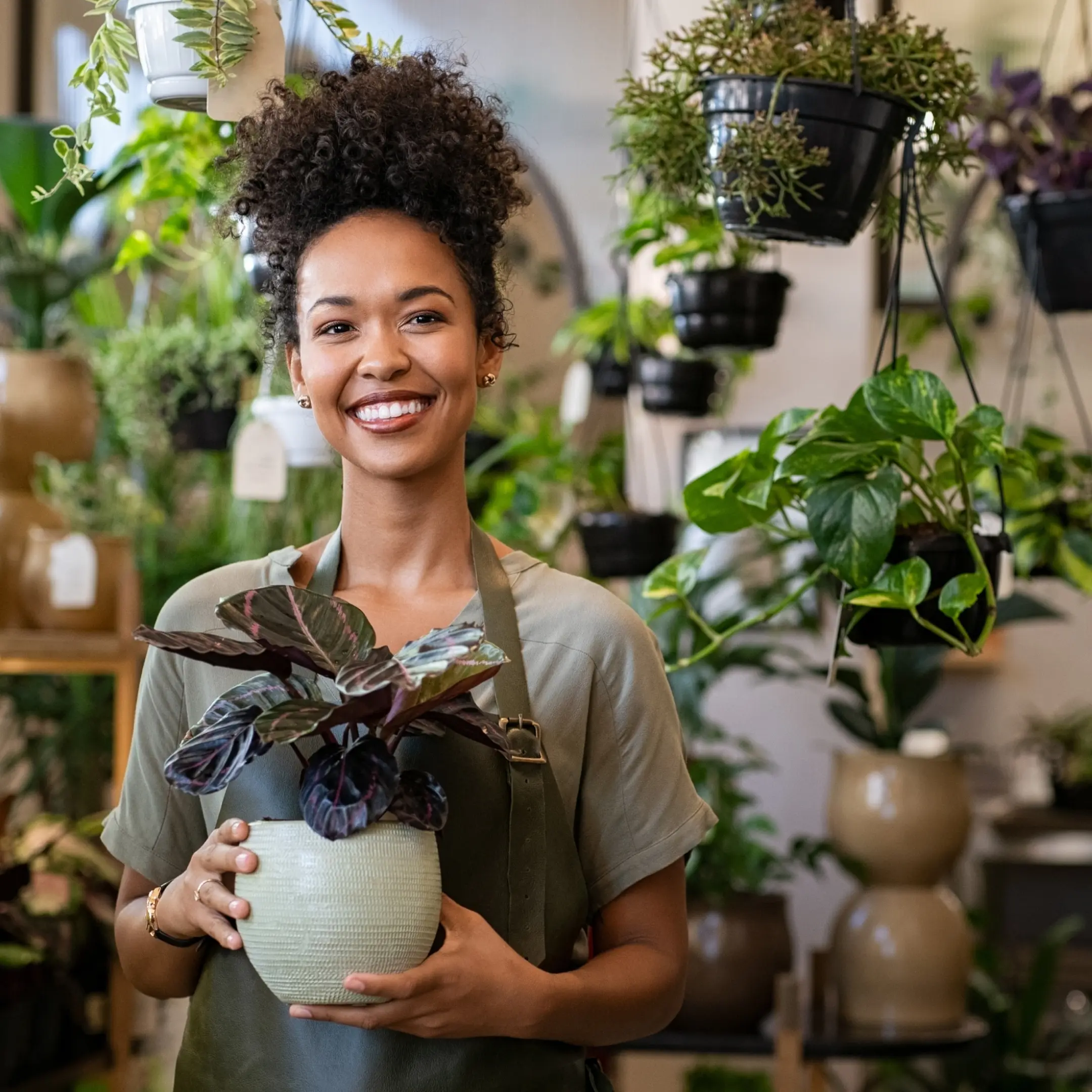 Woman holding a plant